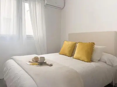 Cama o camas de una habitación en Apartamentos Gredos 102
