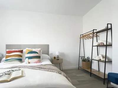 Cama o camas de una habitación en Apartamentos Gredos 102