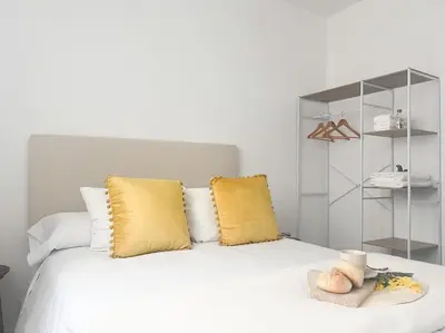 Cama o camas de una habitación en Apartamentos Gredos 104