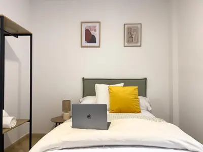 Cama o camas de una habitación en TAYP San Marcos 107