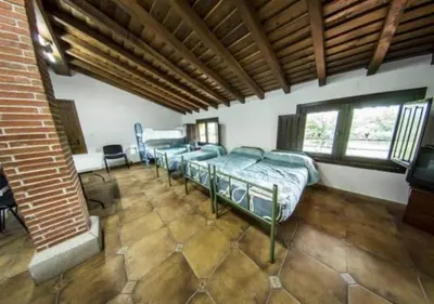Cama o camas de una habitación en Hotel Rural El Abejal