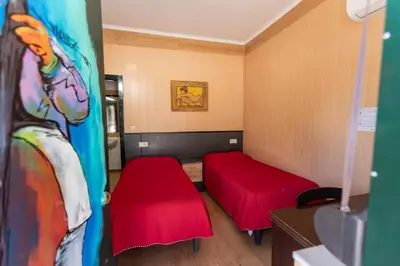 Cama o camas de una habitación en Hostal - Bungalows Camping Cáceres
