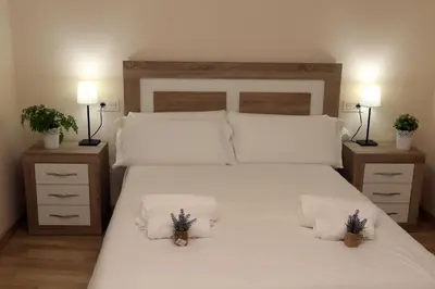 Cama o camas de una habitación en Apartamentos turisticos Puente Romano Portal 4 Bajo -A