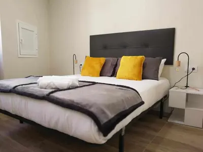 Cama o camas de una habitación en KubiK APARTAMENTOS K3